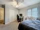 A well-lit bedroom includes a closet and a desk at 4765 Lantern Ct, Orlando, FL 32808