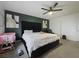 Well-lit bedroom featuring a large bed with tufted headboard and contemporary decor accents at 4765 Lantern Ct, Orlando, FL 32808