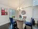 This elegant dining room features unique lighting, a glass table, and attractive decor at 4765 Lantern Ct, Orlando, FL 32808