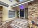 A welcoming front porch with tile steps, brick accents, and a well-maintained entrance at 4765 Lantern Ct, Orlando, FL 32808