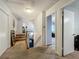 Second floor hallway with carpet, leading to a staircase and bedrooms at 4765 Lantern Ct, Orlando, FL 32808