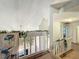 Second floor hallway with unique railing and views into the floor below at 4765 Lantern Ct, Orlando, FL 32808