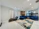 Spacious living room with modern decor, fireplace, and tile flooring, offering open living space at 4765 Lantern Ct, Orlando, FL 32808