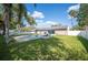 Spacious backyard featuring a refreshing pool, an extended patio, and a well-maintained lawn at 5115 Woodgreen Ln, Lakeland, FL 33811