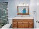 Updated bathroom with new vanity, large mirror, and modern lighting for added brightness at 5115 Woodgreen Ln, Lakeland, FL 33811