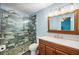 Modern bathroom featuring a glass-enclosed shower, stylish vanity, and updated fixtures at 5115 Woodgreen Ln, Lakeland, FL 33811