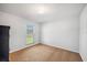 Cozy bedroom with neutral carpet and walls, featuring a window with natural light at 5115 Woodgreen Ln, Lakeland, FL 33811
