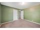 Spacious bedroom featuring neutral carpet, freshly painted walls, and ample natural light at 5115 Woodgreen Ln, Lakeland, FL 33811