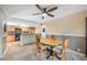 Cozy dining area next to the kitchen featuring plush carpet and neutral toned walls at 5115 Woodgreen Ln, Lakeland, FL 33811