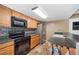 Kitchen with stainless steel appliances, sleek countertops, and modern backsplash tiles for a stylish culinary space at 5115 Woodgreen Ln, Lakeland, FL 33811
