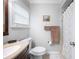 Bright bathroom features neutral decor, vanity with stone countertop and a shower with curtain at 513 Kelsey St # 513, Lakeland, FL 33803