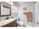 Bathroom features neutral decor, vanity with stone countertop, and a shower with curtain at 513 Kelsey St # 513, Lakeland, FL 33803
