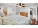 Serene bedroom featuring hardwood floors, ceiling fan, and natural light, offering a relaxing retreat at 513 Kelsey St # 513, Lakeland, FL 33803