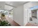 Covered walkway featuring brick flooring and a seating area at 513 Kelsey St # 513, Lakeland, FL 33803