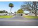 Street view of homes with well-kept lawns and carports at 513 Kelsey St # 513, Lakeland, FL 33803