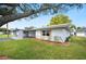 Charming single-story home with lush green lawn and attached carport at 513 Kelsey St # 513, Lakeland, FL 33803