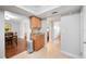 Hallway with tile flooring, cabinetry, and a view into the dining room and another room at 513 Kelsey St # 513, Lakeland, FL 33803
