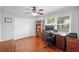 Bright home office features wood floors, desk with drawers, window view and a ceiling fan at 513 Kelsey St # 513, Lakeland, FL 33803