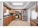 Well-equipped kitchen featuring stainless steel appliances, granite countertops, and ample cabinet space at 513 Kelsey St # 513, Lakeland, FL 33803
