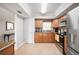 Functional kitchen featuring stainless steel appliances, tile flooring, and ample counter space at 513 Kelsey St # 513, Lakeland, FL 33803