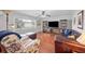 Cozy living room with hardwood floors, a ceiling fan, and ample natural light at 513 Kelsey St # 513, Lakeland, FL 33803