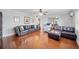 Open-concept living room featuring a leather sectional, hardwood floors, and a bright, airy atmosphere at 513 Kelsey St # 513, Lakeland, FL 33803
