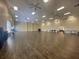 Large event space with wood floors and ceiling fans at 5268 Pebble Beach Blvd, Winter Haven, FL 33884
