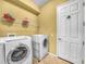 Functional laundry room with modern front load machines at 5268 Pebble Beach Blvd, Winter Haven, FL 33884