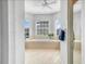 Bright bathroom featuring a soaking tub, tile floor and three large windows at 5268 Pebble Beach Blvd, Winter Haven, FL 33884