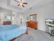 Neutral main bedroom with a dresser and view to the bathroom at 5268 Pebble Beach Blvd, Winter Haven, FL 33884