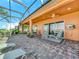 Outdoor patio with brick pavers, ceiling fan and beautiful golf course and lake views at 5268 Pebble Beach Blvd, Winter Haven, FL 33884
