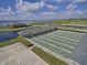 Aerial view of shuffleboard courts and the lake at 5268 Pebble Beach Blvd, Winter Haven, FL 33884