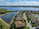 Aerial view of a lakeside community showcasing beautiful homes, water views, and the home's prime location at 5357 Hogan Ln, Winter Haven, FL 33884