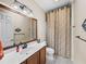 Bathroom featuring vanity with sink, large mirror, and a shower with a decorative curtain at 5357 Hogan Ln, Winter Haven, FL 33884