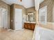 Bathroom featuring a soaking tub and a vanity with dark wood cabinets at 5357 Hogan Ln, Winter Haven, FL 33884