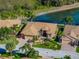 Beautiful single-Gathering home boasting mature landscaping, barrel tile roof, and paver driveway at 5357 Hogan Ln, Winter Haven, FL 33884