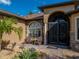 Charming front entrance with stone accents, decorative glass doors, and a beautifully landscaped walkway at 5357 Hogan Ln, Winter Haven, FL 33884