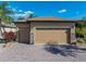 Spacious three-car garage with beautiful paver driveway and stone accents enhances the curb appeal of this home at 5357 Hogan Ln, Winter Haven, FL 33884