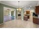 Spacious kitchen featuring dining area, wood cabinets, granite counters and stainless steel appliances at 5357 Hogan Ln, Winter Haven, FL 33884