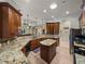 A kitchen showcasing wood cabinets, granite countertops and stainless steel appliances at 5357 Hogan Ln, Winter Haven, FL 33884