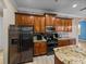 A kitchen featuring wood cabinets, granite countertops and stainless steel appliances at 5357 Hogan Ln, Winter Haven, FL 33884