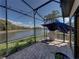 Screened lanai offers lake views, ample seating, and a relaxing atmosphere at 5357 Hogan Ln, Winter Haven, FL 33884