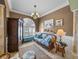 Cozy living room featuring a decorative window, stylish furniture, and elegant decor at 5357 Hogan Ln, Winter Haven, FL 33884