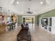Open-concept living room featuring tiled floors, and a view to the lake at 5357 Hogan Ln, Winter Haven, FL 33884