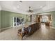 Bright living room with a view to a sitting area, large TV, and tiled floor at 5357 Hogan Ln, Winter Haven, FL 33884