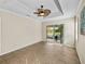 Spacious living room with ceiling fan and view of the outdoors at 5357 Hogan Ln, Winter Haven, FL 33884