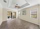 Open living area with tile floors and sliding glass door to the lanai at 5357 Hogan Ln, Winter Haven, FL 33884