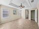 Bright main bedroom with tray ceiling, and large windows at 5357 Hogan Ln, Winter Haven, FL 33884