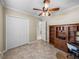 Home office boasts built-in desk, closet, and plenty of room for storage at 5357 Hogan Ln, Winter Haven, FL 33884