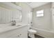Bathroom featuring a single sink vanity and bathtub with tiled surround at 583 Drayton Rd, Winter Haven, FL 33884